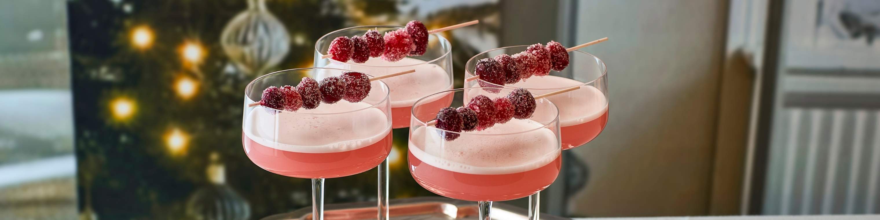 juledrink med tranebær i champagneglas